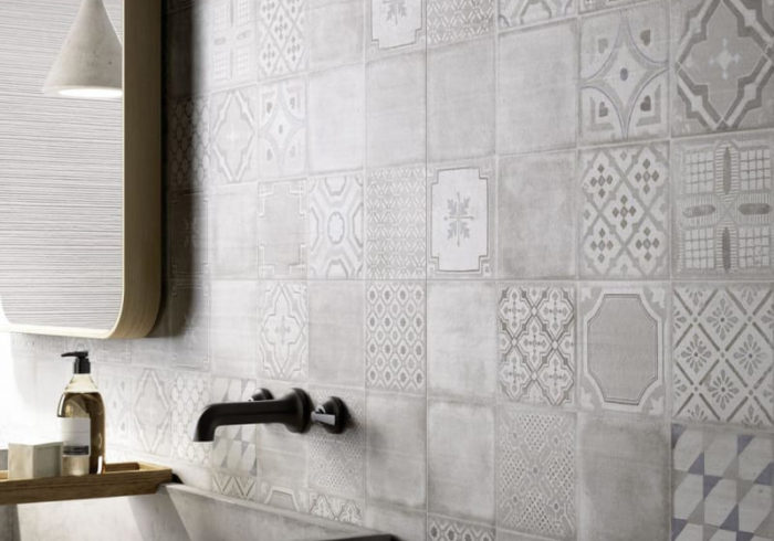 Matte Black Faucet Against Patterned Tiles (Marazzi Group)
