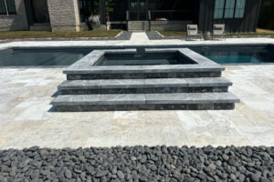 Orcca® coping and treads with Carya® sandblasted pavers